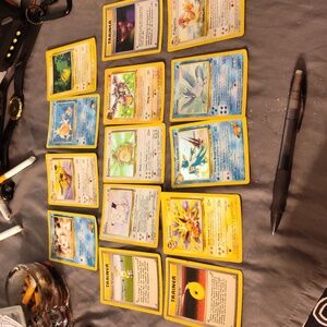 Lot of 11 first edition Pokemon cards with a black star pikachu
